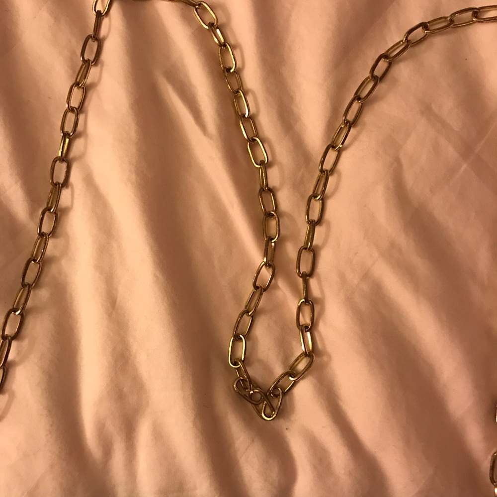 Black purse with gold chain strap